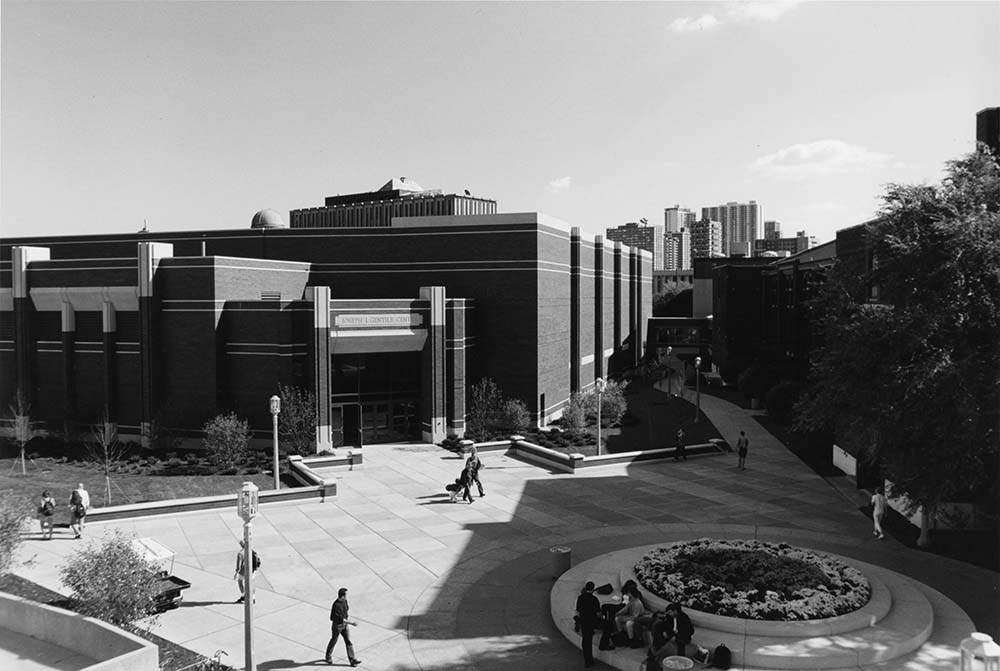 Students walk by Gentile Center, which includes Gentile Arena, located next to Alumni Gym