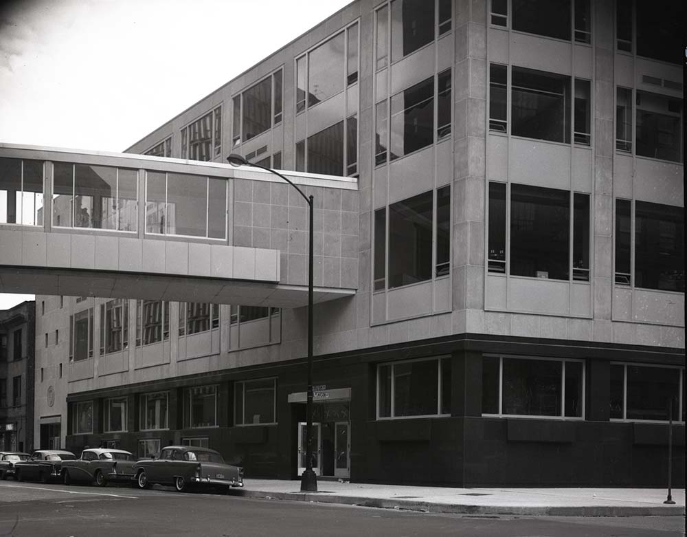 Exterior view of Marquette Center on the Water Tower Campus soon after construction was completed. The skybridge from Marquette Center to Lewis Towers is visible on the building.