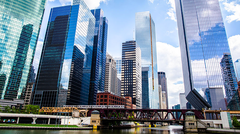 Chicago downtown skyline with bridge and train over the Chicago river