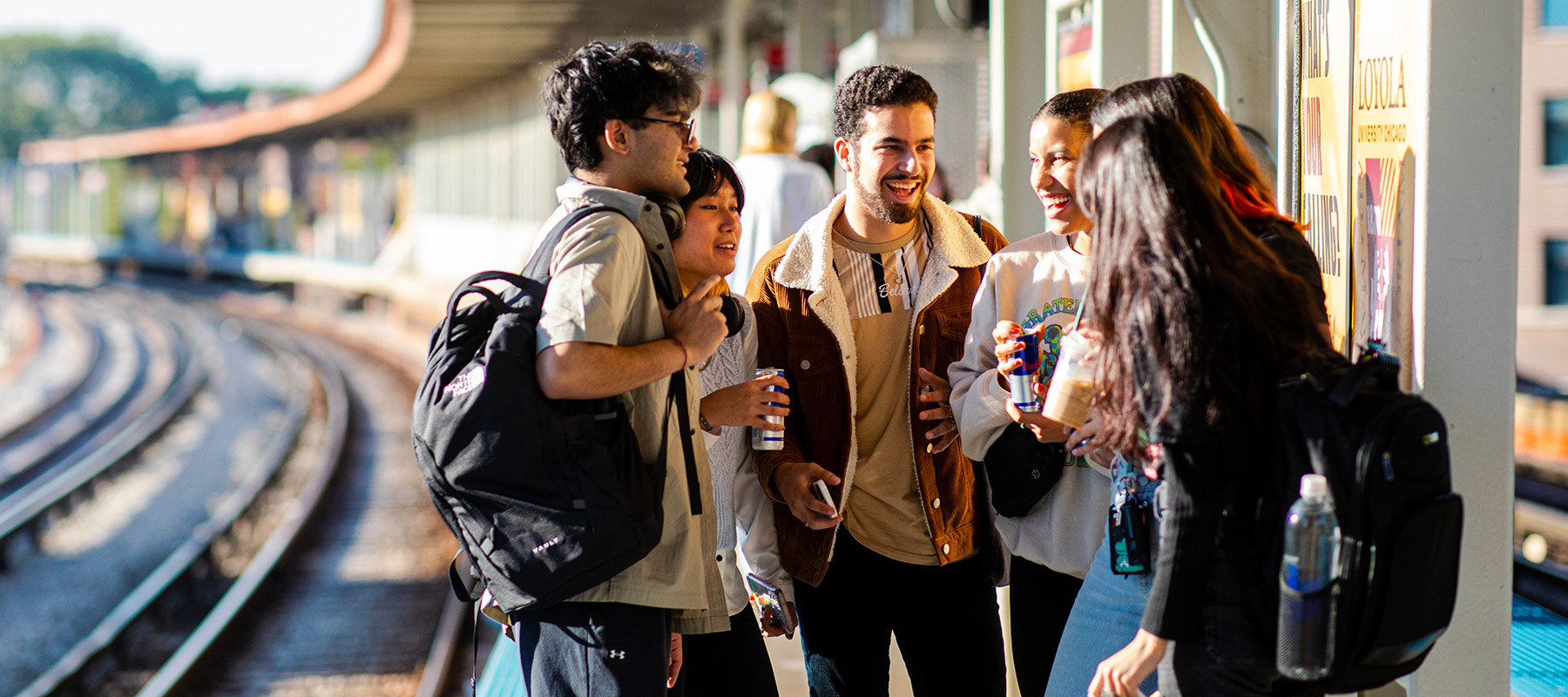 Students socializing at the Loyola Redline stop