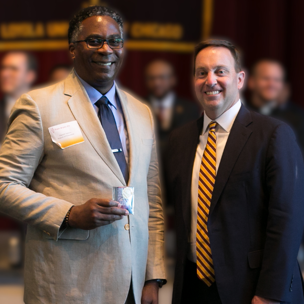 Loyola Chicago student Darrell Nabers is inducted into Alpha Sigma Nu.