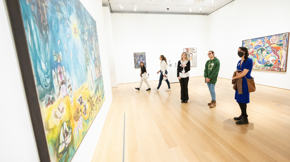 Loyola students standing at painting at Art Institute of Chicago