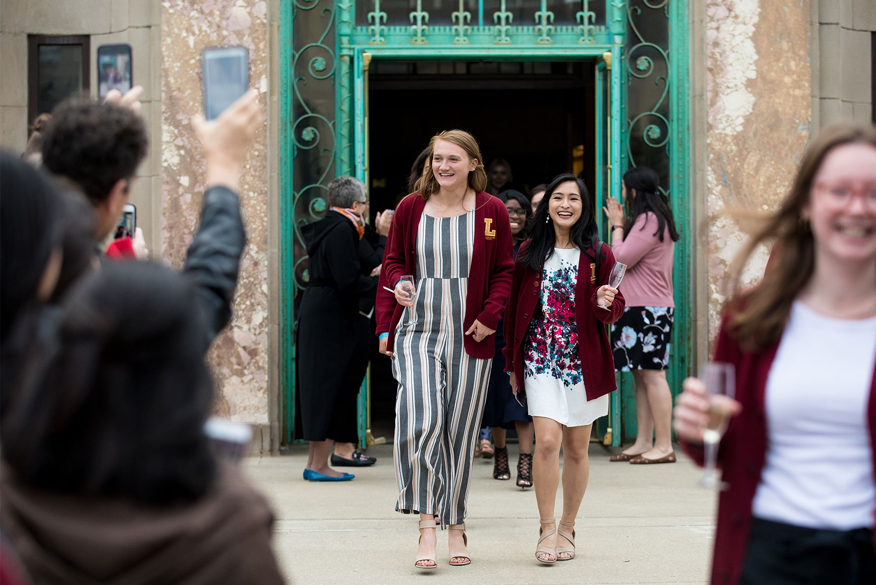 Loyola School of Education seniors celebrate walking through the Cudahy doors