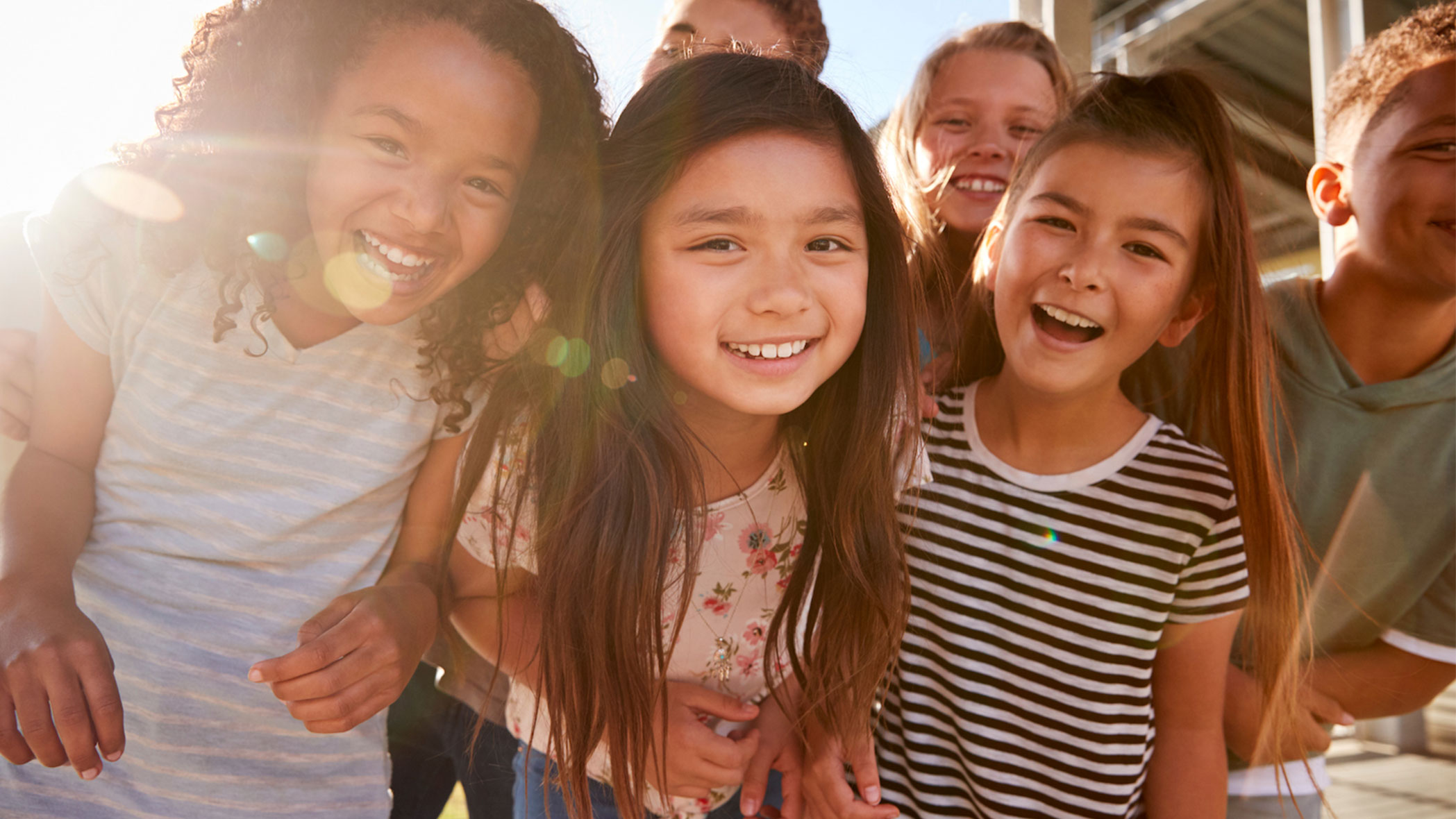 Loyola School of Education partner school's students smile outside