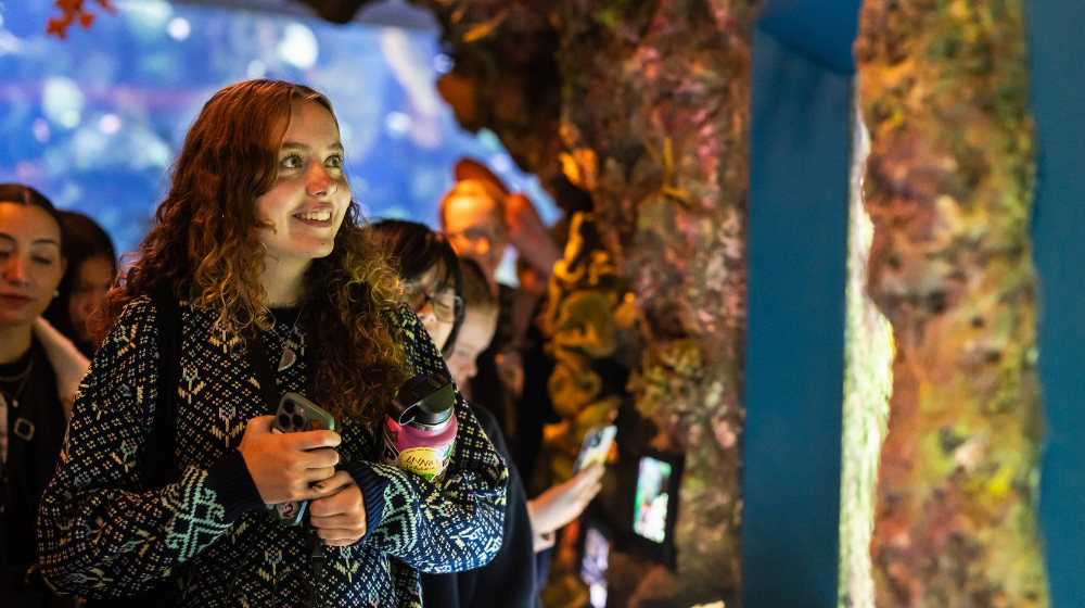 A student admires Shedd Aquairum.