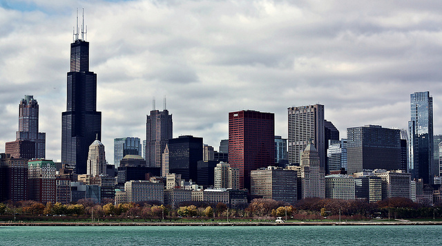 The Chicago skyline from the view of Lake Michigan, on a partly cloudy day.