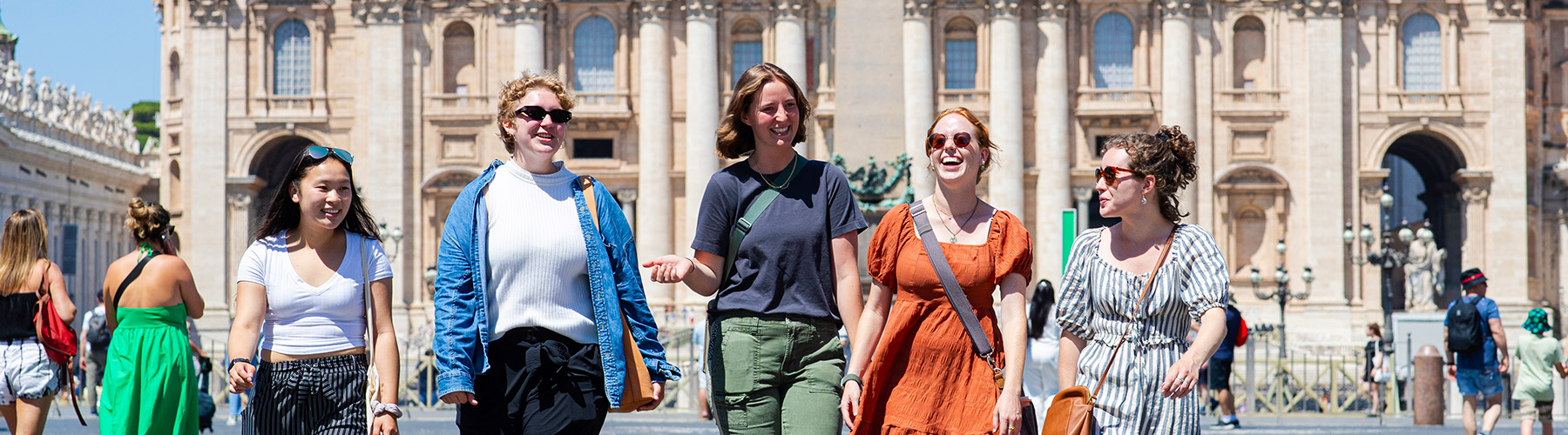 Students enjoy the scenery at the center of a square in Rome