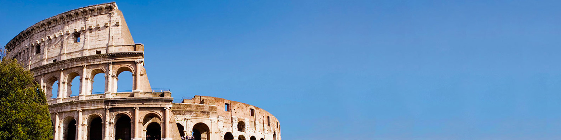 An exterior view of a roman colosseum and sky