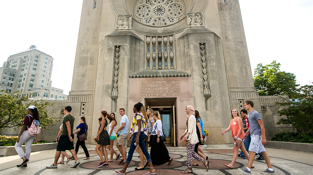 Students walking past the chapel entrance during new student convocation