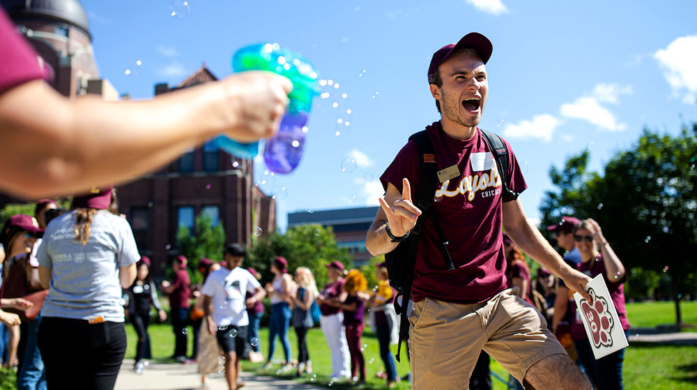 student walking during new student convocation