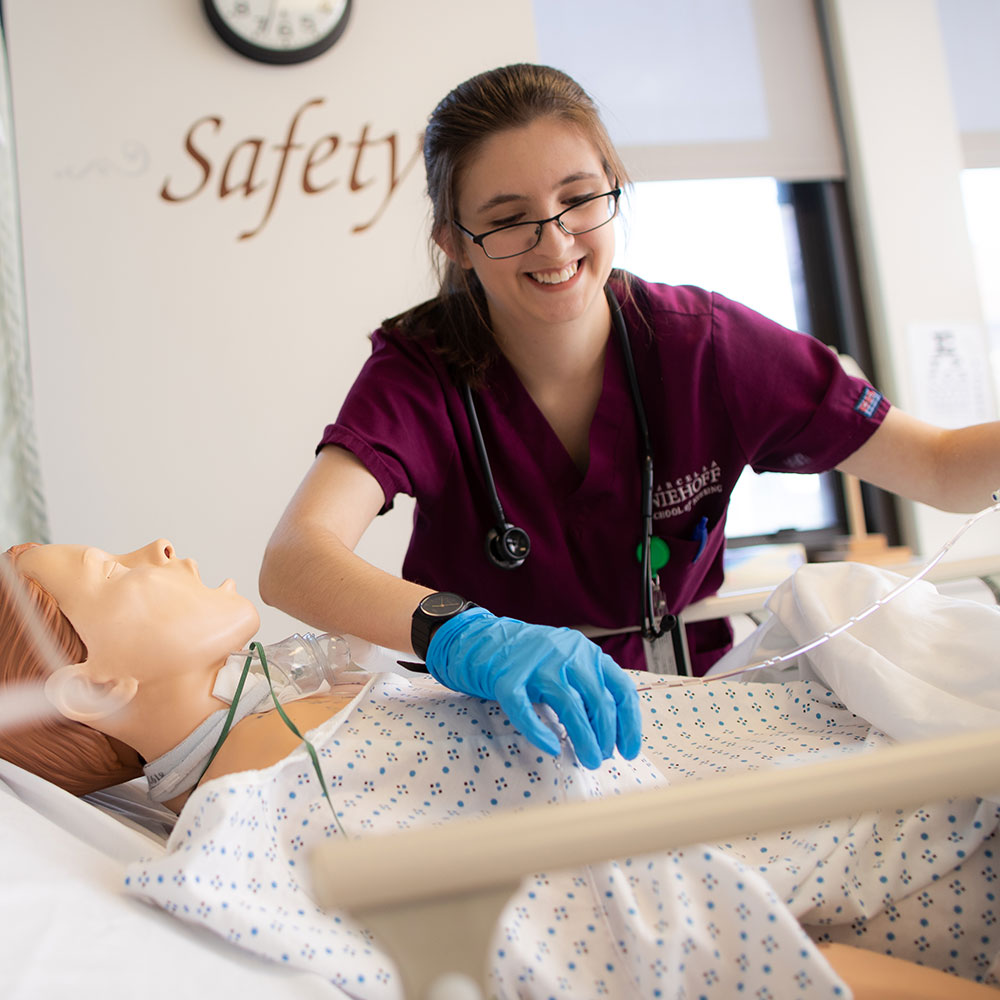 Student Grace Murphy works n the Marcella Niehoff School of Nursing simulation lab