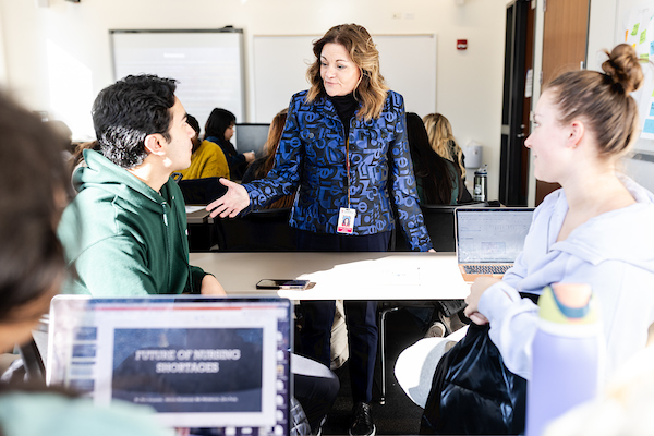 Instructor interacting with students