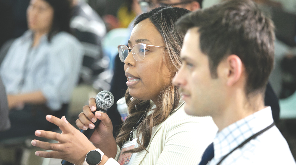 Woman speaking into microphone