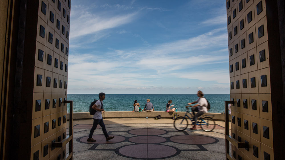 A view of the lake through the doors of Madonna Della Strada Chapel.