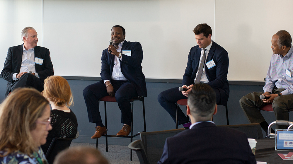 Caption: Sean Garrett, Darnell Shields, Craig Howard, David Doig, and Thomas Oldenburg discuss winning approaches to collective impact.