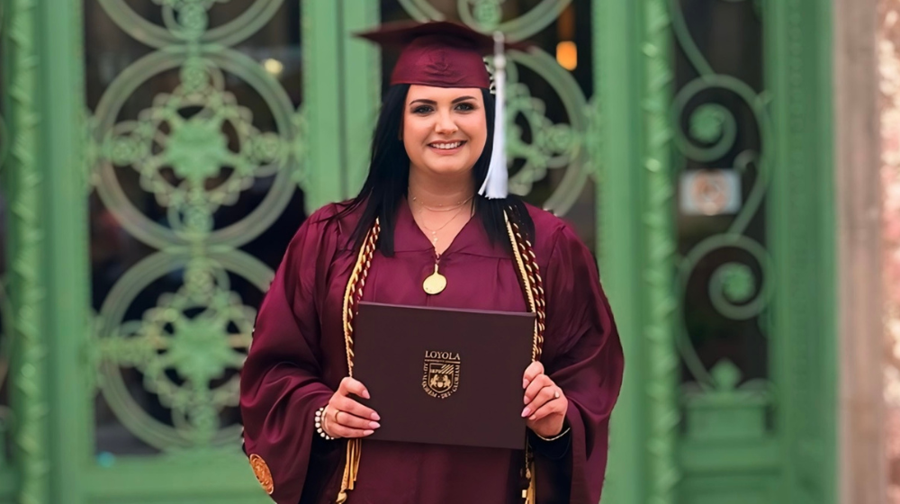 Loyola SCPS graduate Kinga Guza with her diploma