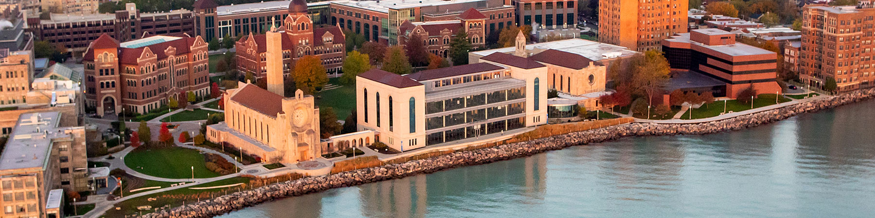  An aerial view of Loyola University Chicago Lake Shore campus from above Lake Michigan