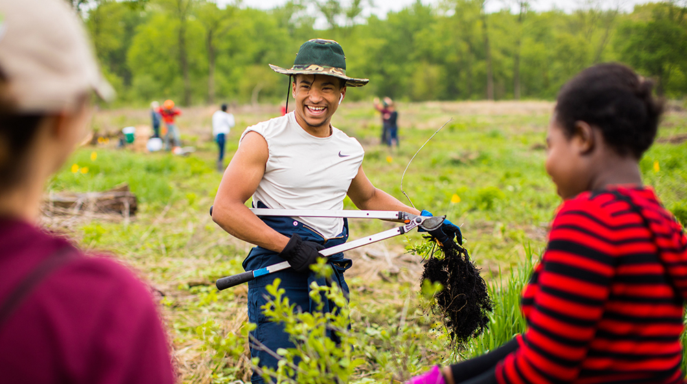 Students conducting ecological restoration work 