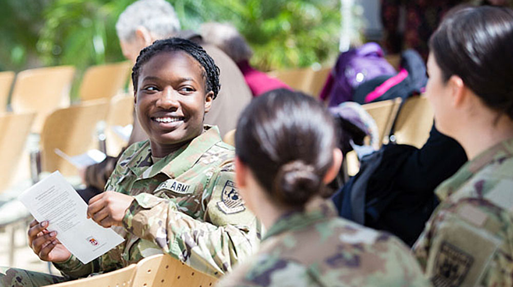 Veterans, members of the military service, and ROTC members interact at Loyola University Chicago.