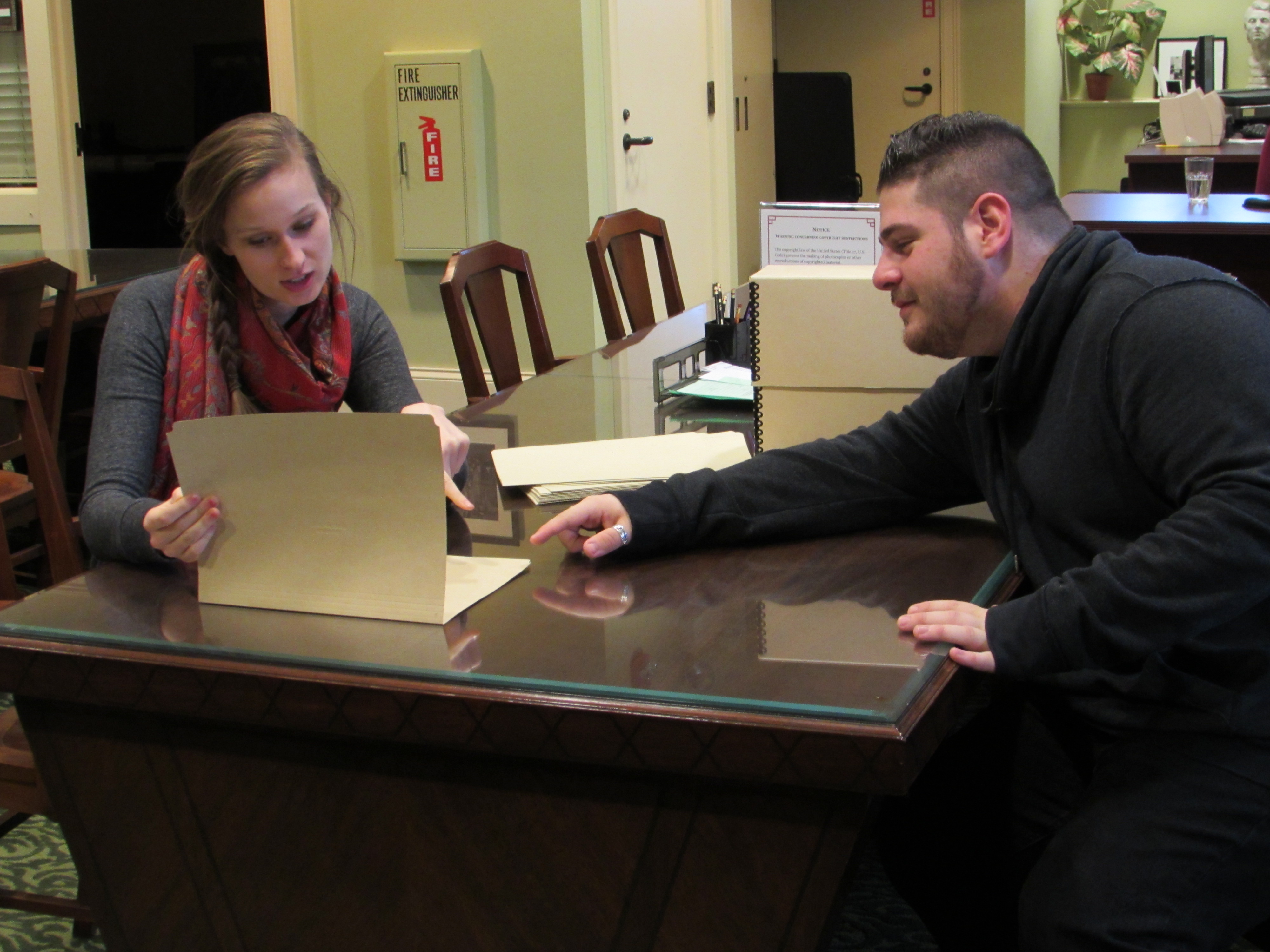 Interns Elyse Voyen and Adam Mogilesky working at the WLA